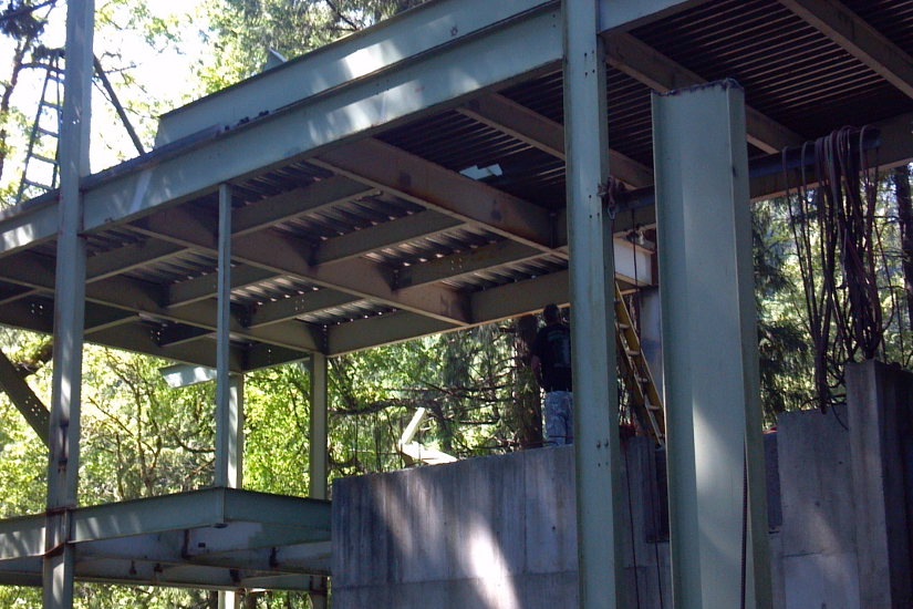Structural steel framing detail at the Caldwell project, highlighting the engineered metal system supporting the custom home.